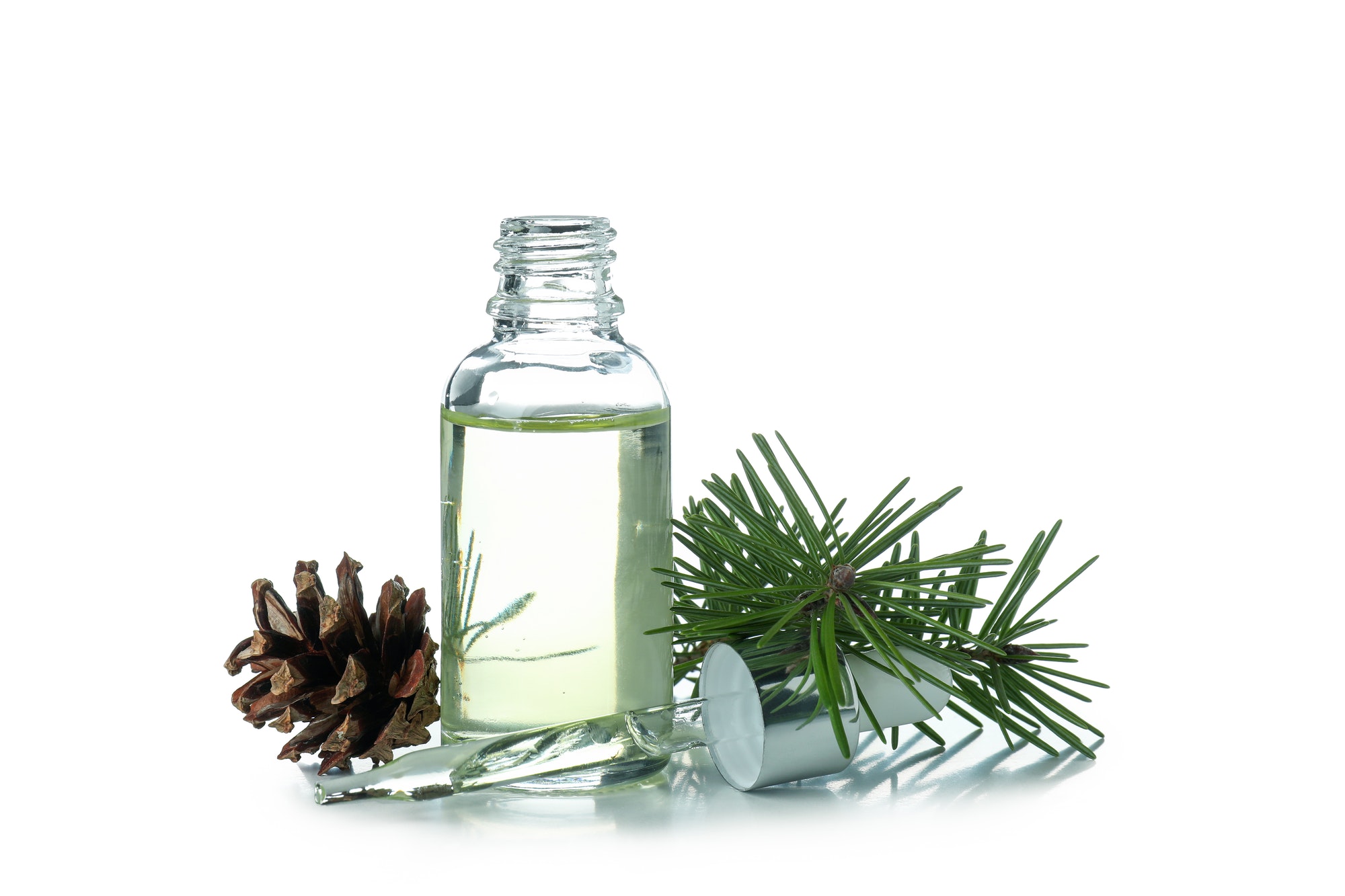 pine essential oil isolated on white background.jpg